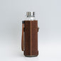 Leather water bottle holder with strap and glass bottle